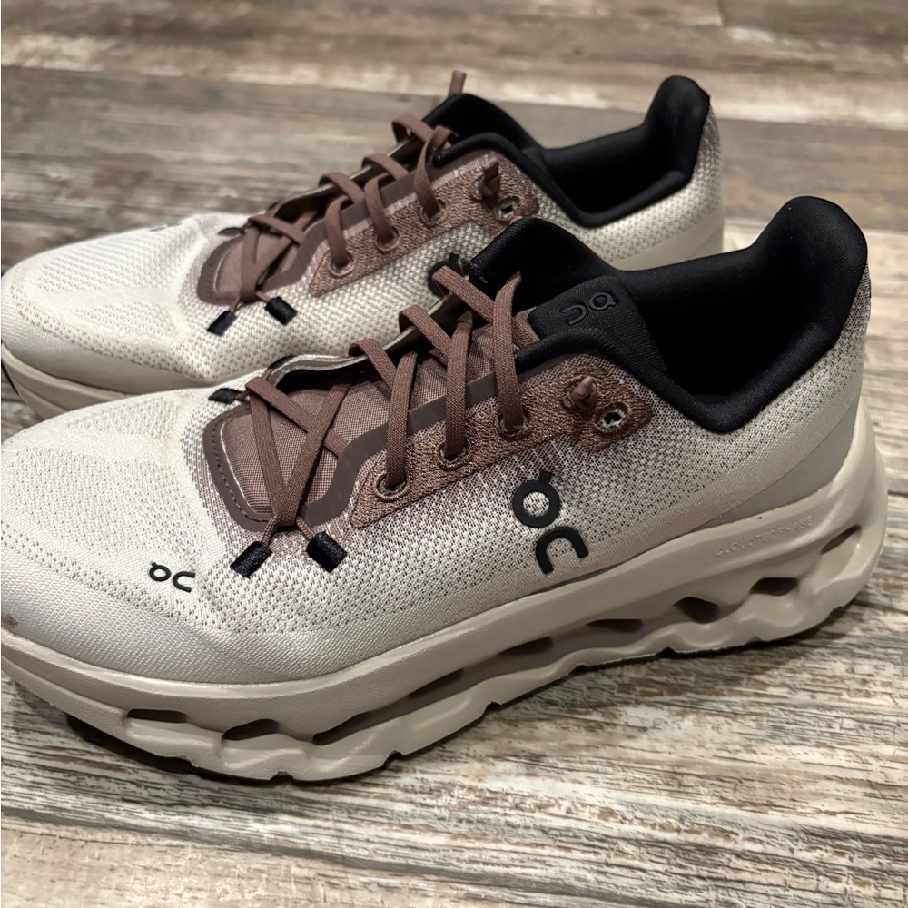 On Running White and Brown Sneakers with CloudTec Technology